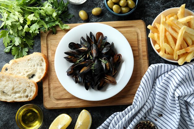 Concept of delicious food with mussels, top view