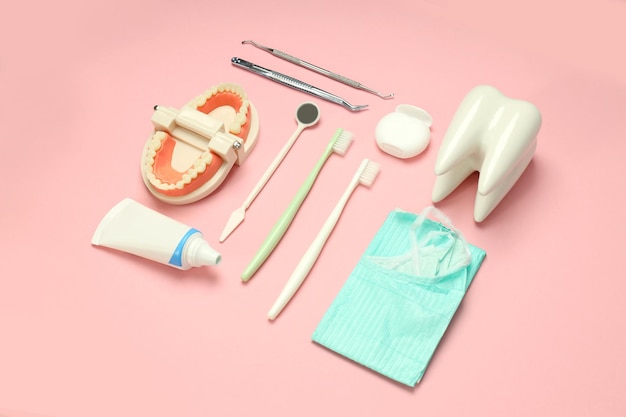 Concept of dental care or tooth care on pink background