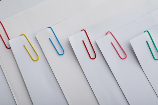 Concept of different office accessories paper with clip