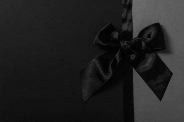 Concept of different ribbons black ribbon on two tone background
