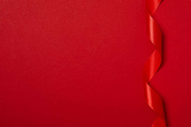 Concept of different ribbons red ribbon on red background