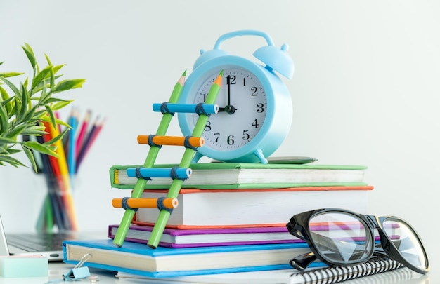 Concept Education or business a lot of book with fashion glasses on blue pastel background