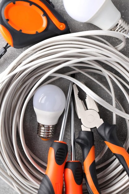 Concept of electrician or electrical tools close up