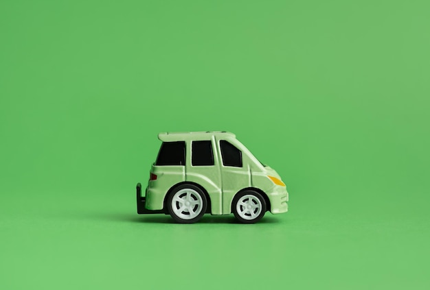 Photo the concept of the environment the concept of ecology green car on a green background