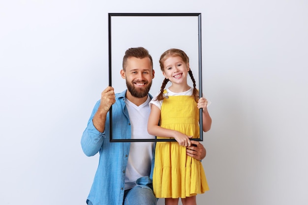 Concept of the family father and child to daughter near empty wall