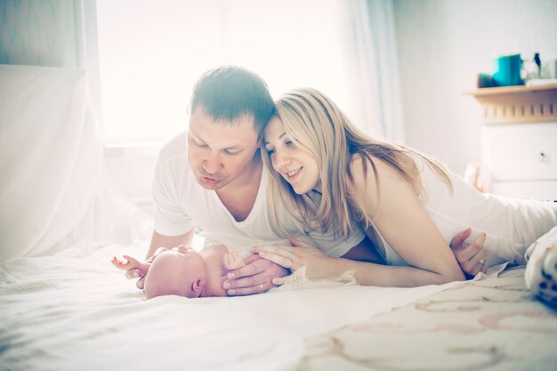 Concept of family happiness happy parents and the newborn baby