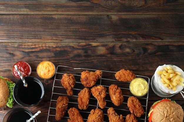 Concept of fast food on wooden table