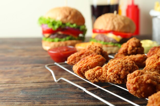 Concept of fast food on wooden table