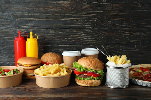 Concept of fast food on wooden table