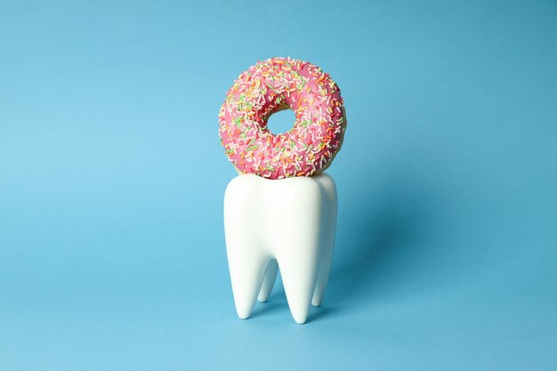 Concept of food bad for teeth on blue background