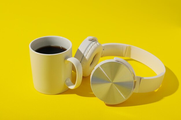 Concept of freelance composition with hot drink and headphones