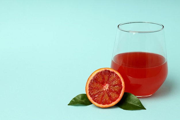 Concept of fresh drink with red orange juice space for text