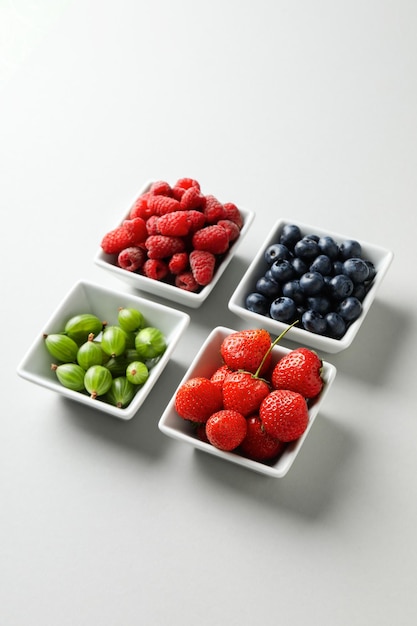 Concept of fresh food berries on light background