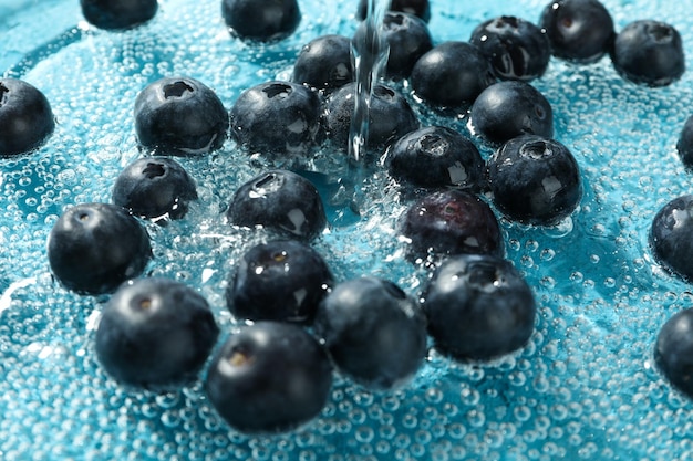 Concept of fresh summer fruits blueberry in water