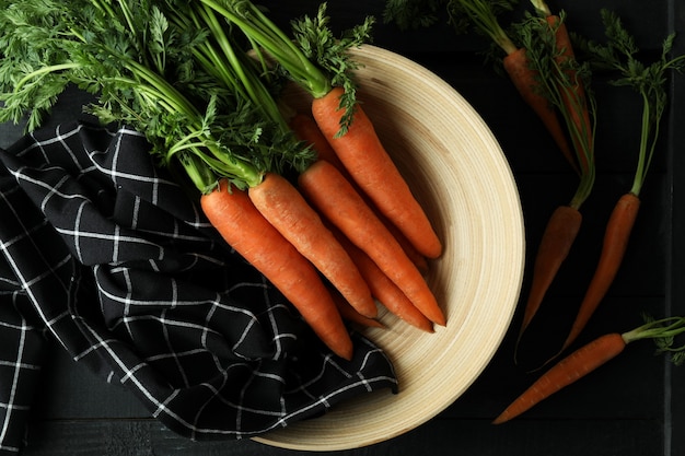 Concept of fresh vegetable with carrot on dark wooden table