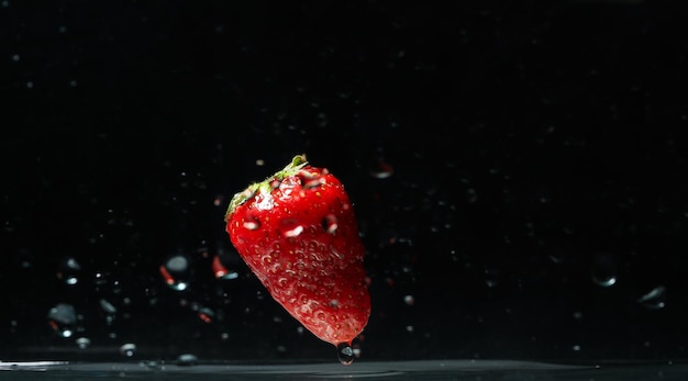 Photo concept of freshness fresh strawberry against dark