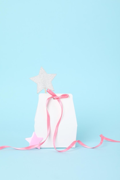 Concept of gift gift bag on blue background