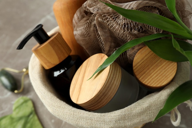 Photo concept of gift with basket of cosmetics, close up