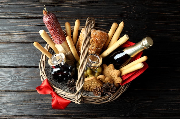 Concept of gift with Christmas basket on dark background