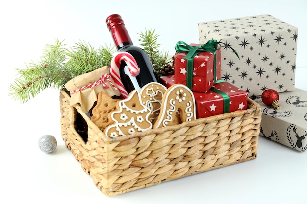 Photo concept of gift with christmas basket on white background