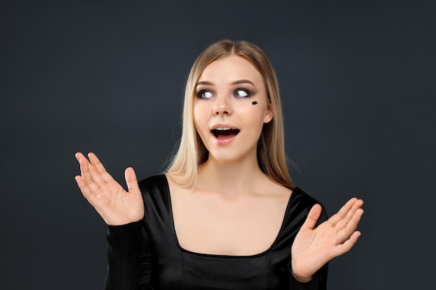 Concept of Halloween young woman on dark background