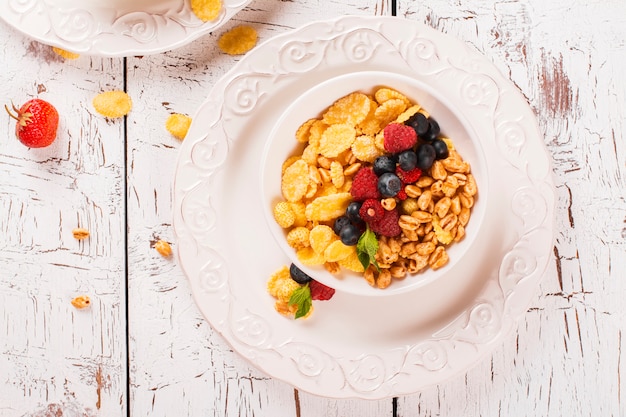 Concept of healthy breakfast with muesli and fresh berries. 