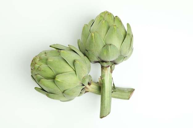 Concept of healthy food with artichoke on white background