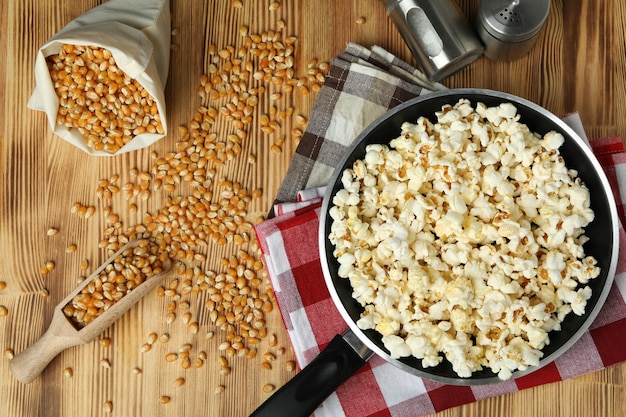 Concept of homemade popcorn on wooden backgroundÃÂ