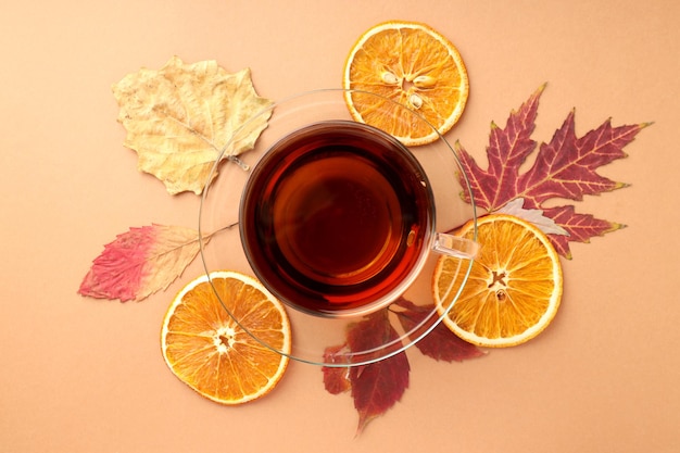 Concept of hot drink with tea on beige background