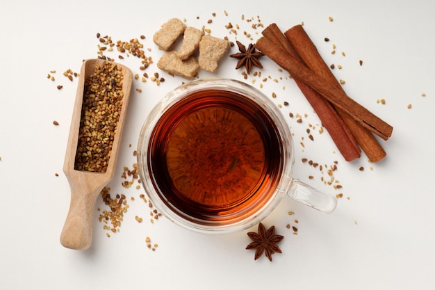 Concept of hot drink with tea on white background