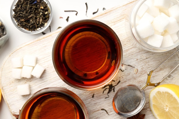 Concept of hot drink with tea on white background