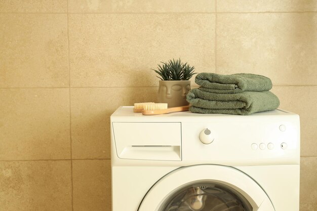 Concept of housework with washing machine in bathroom