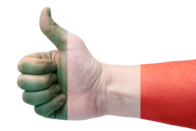 The concept of Italythe hand gives a thumbs up with the flag of Italy