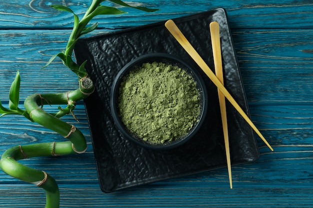 Concept of japanese tea with matcha on blue wooden table