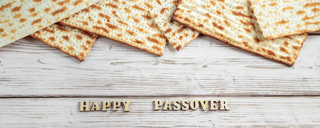 Concept of Jewish holiday Pesach Passover Traditional matzah on white wooden background