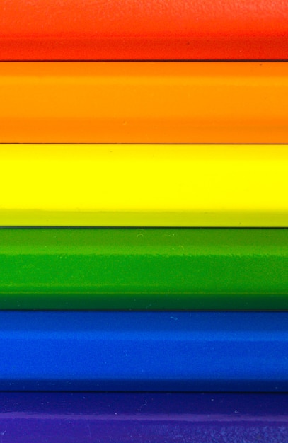 Concept of LGBT and LGBTQ rainbow flag made with colored pencils, vertical photo