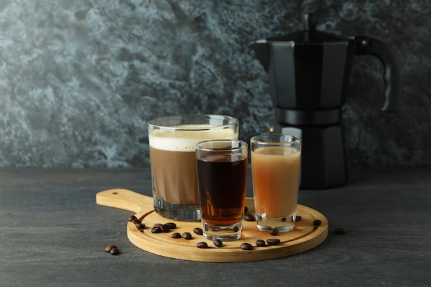 Concept of making Irish coffee on dark wooden table