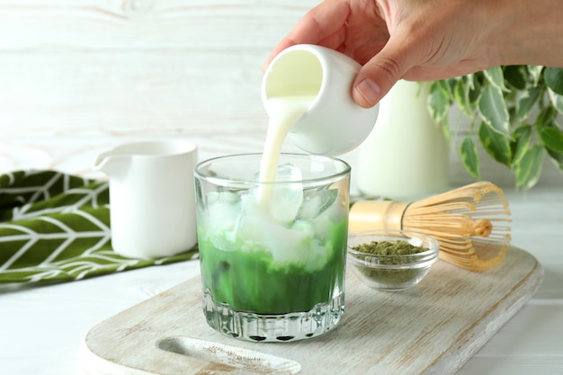 Concept of making matcha latte, close up