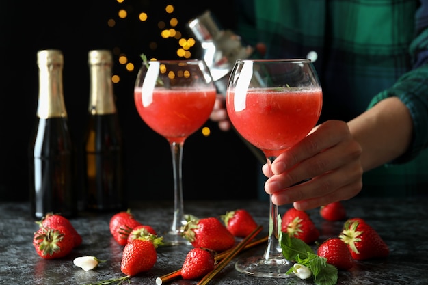 Concept of making Rossini cocktails against dark background