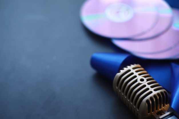 The concept of media presentations. Retro microphone on the background. Concert and show poster. Music album cover.