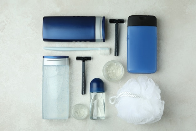 Concept of men's hygiene tools on white textured table