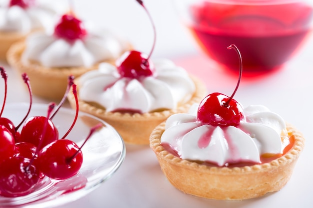 Concept of a mini-confectionery or large confectionery factory. Production of cakes and sweet pastries with cream.