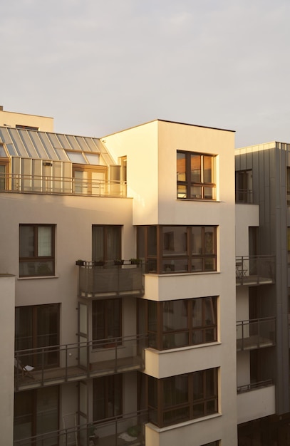 Concept of modern architecture for a better living Contemporary mediumsized flat building in Europe Sunset in a European middle house apartment