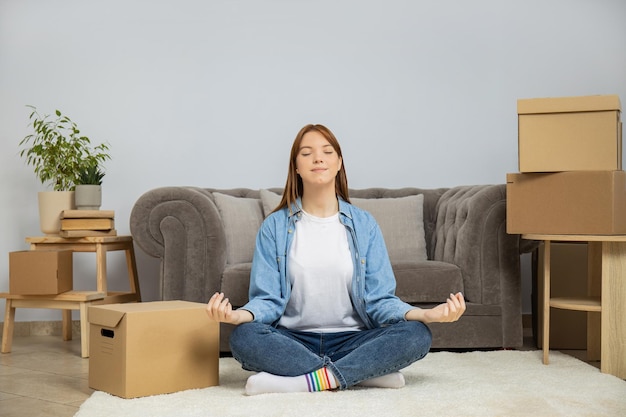 Concept of move with young woman in modern flat