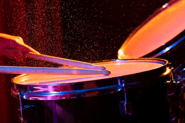 the concept of musical instruments with splashing water on dark background with studio lighting