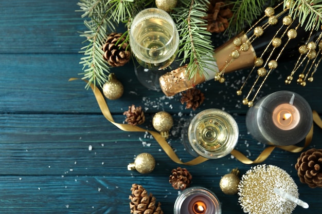 Concept of New Year celebration with champagne on wooden table.