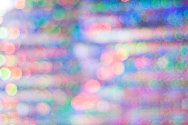 Concept of new year, Christmas background. Multi-colored bokeh in pink and blue tones.