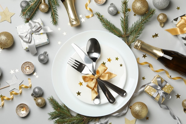 Concept of New year table setting on gray background