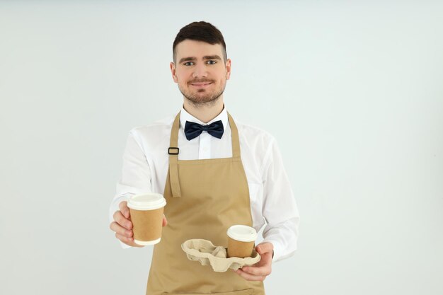 Concept of occupation young waiter on light background