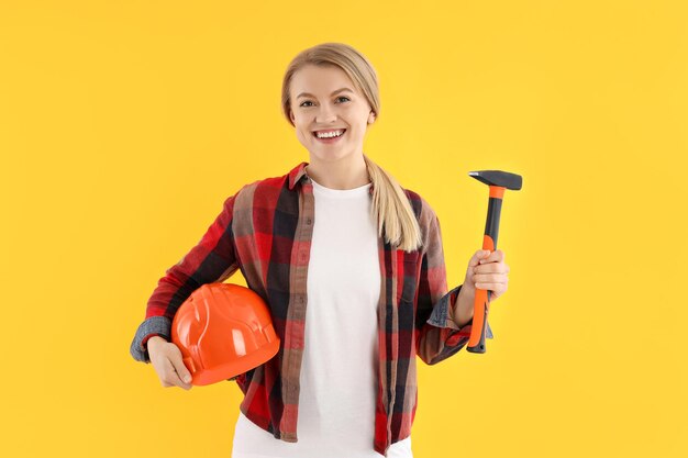 Concept of occupation young woman on yellow background